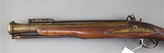 A late 18th century flintlock blunderbuss with sprung bayonet and brass barrel, 29in.